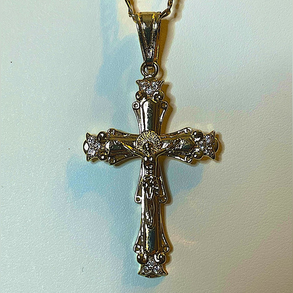 18k Gold Filled Cross & Figaro Chain. Cross hangs 2-1/2” Figaro Chain is 22”